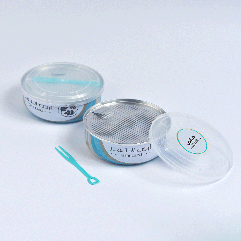 علب معدنية تمر خلاص بالزنجبيل والحلوة منزوع النوى